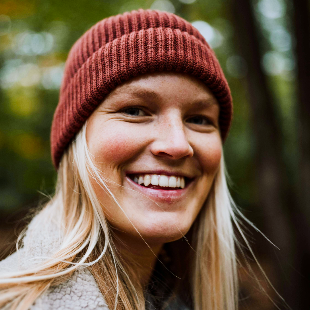 Smiling portrait of a woman in a beanie